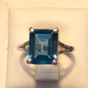 Emerald cut blue ring